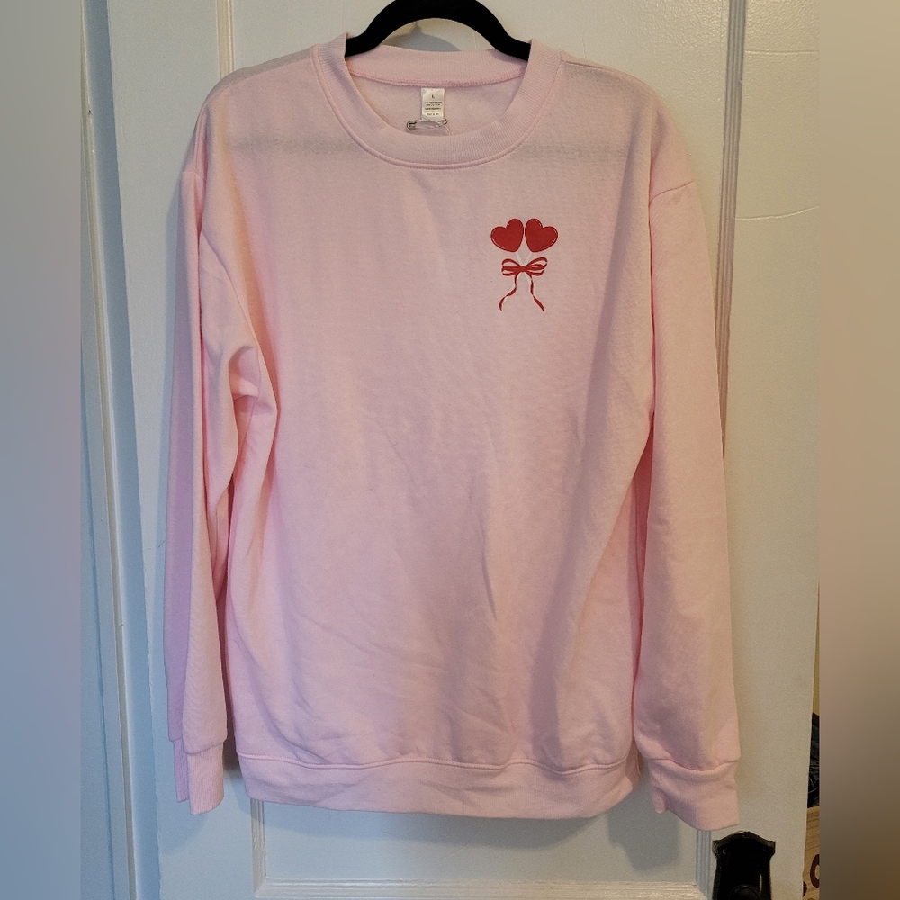 Pink Sweater with Heart and Bow Design